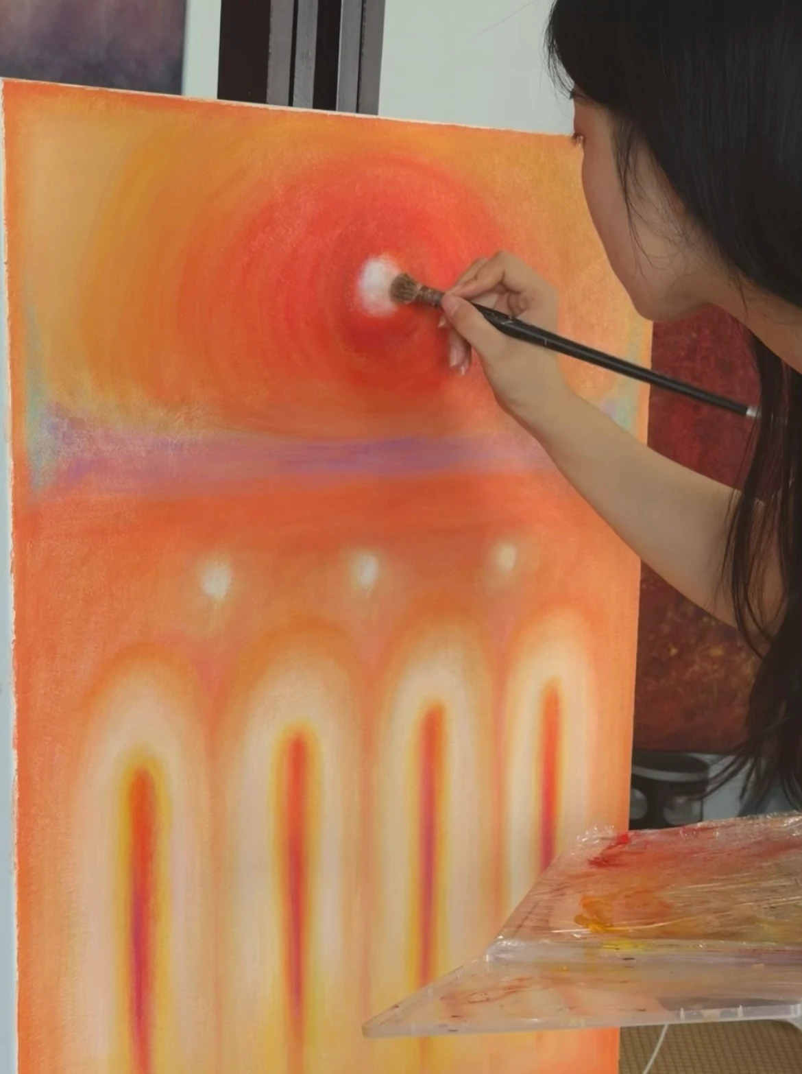 Na Xin painting in the studio